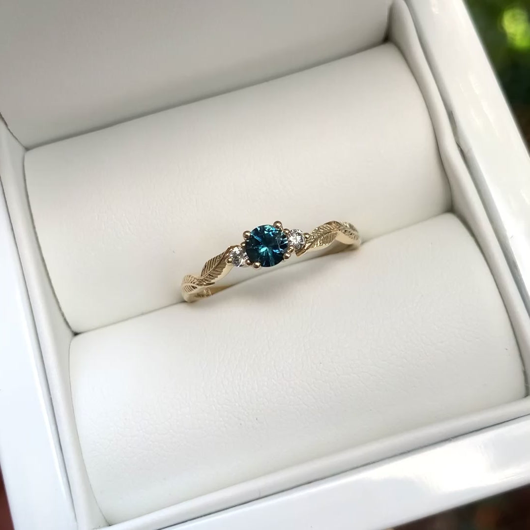 teal sapphire and diamond leaf engagement ring