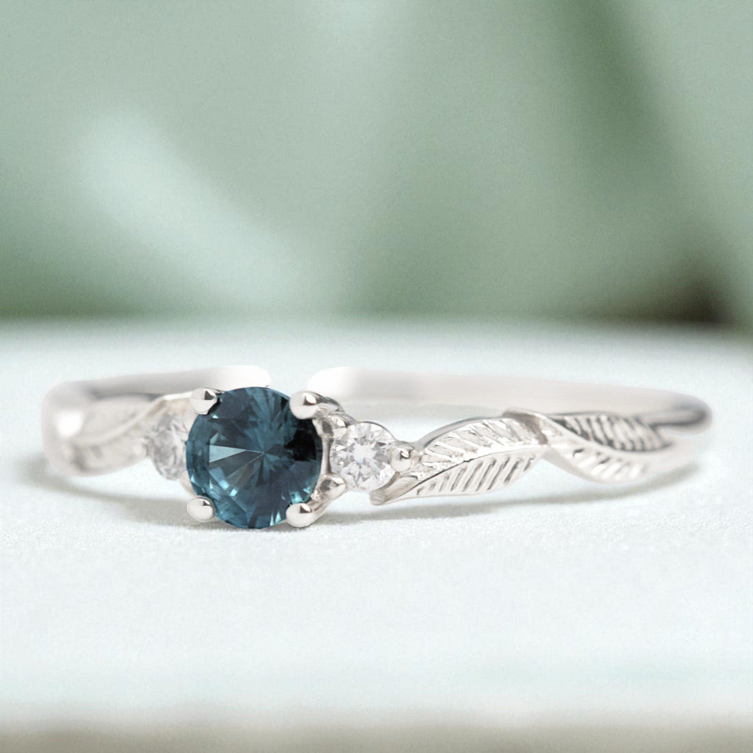 teal-sapphire-diamond-leaf-engagement-ring-white-gold