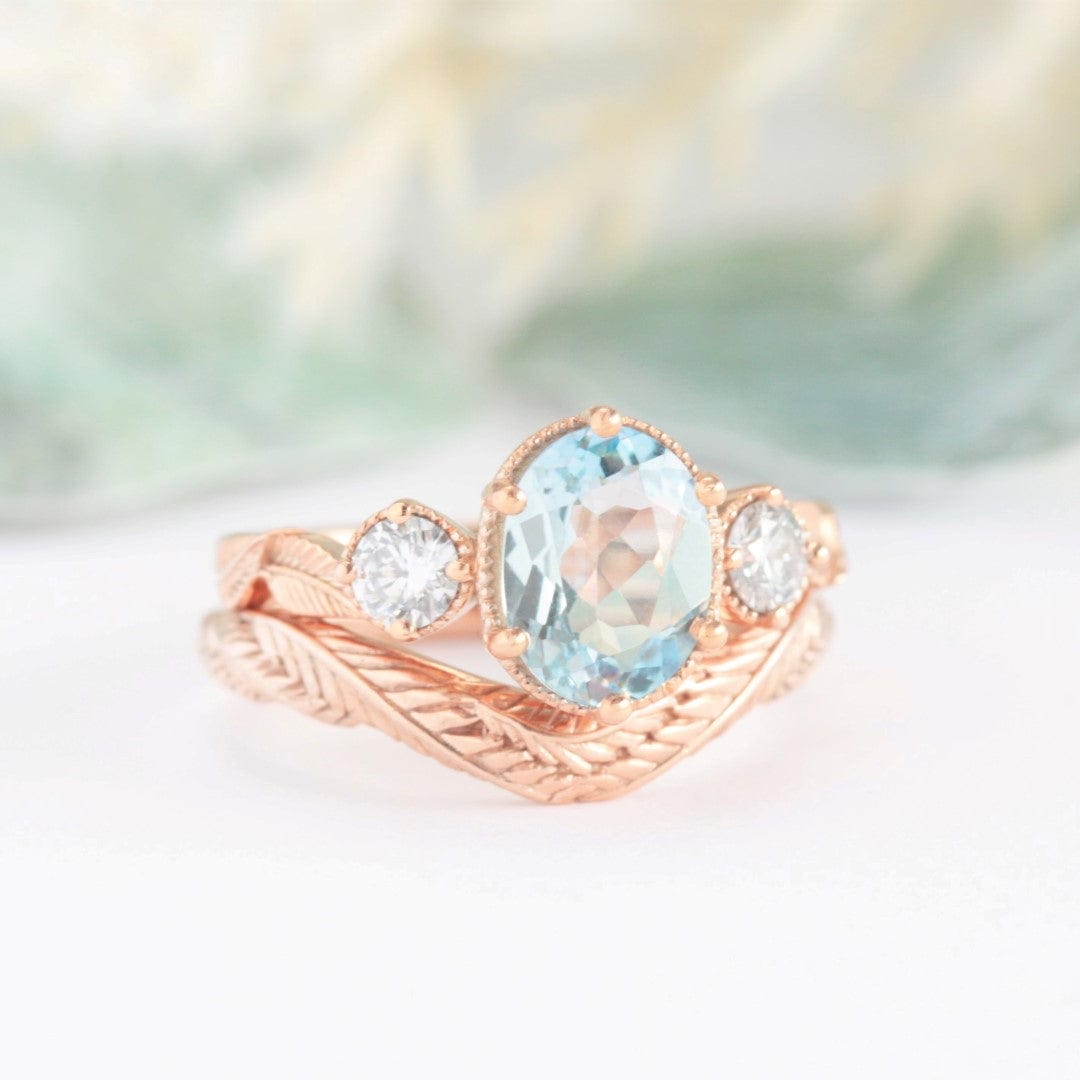 oval aquamarine and diamond leaf ring rose gold